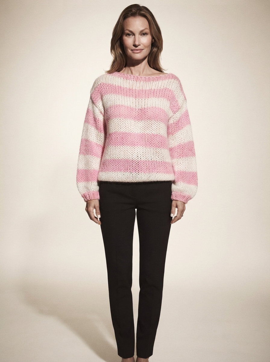 Model wearing pink striped knit pullover sweater