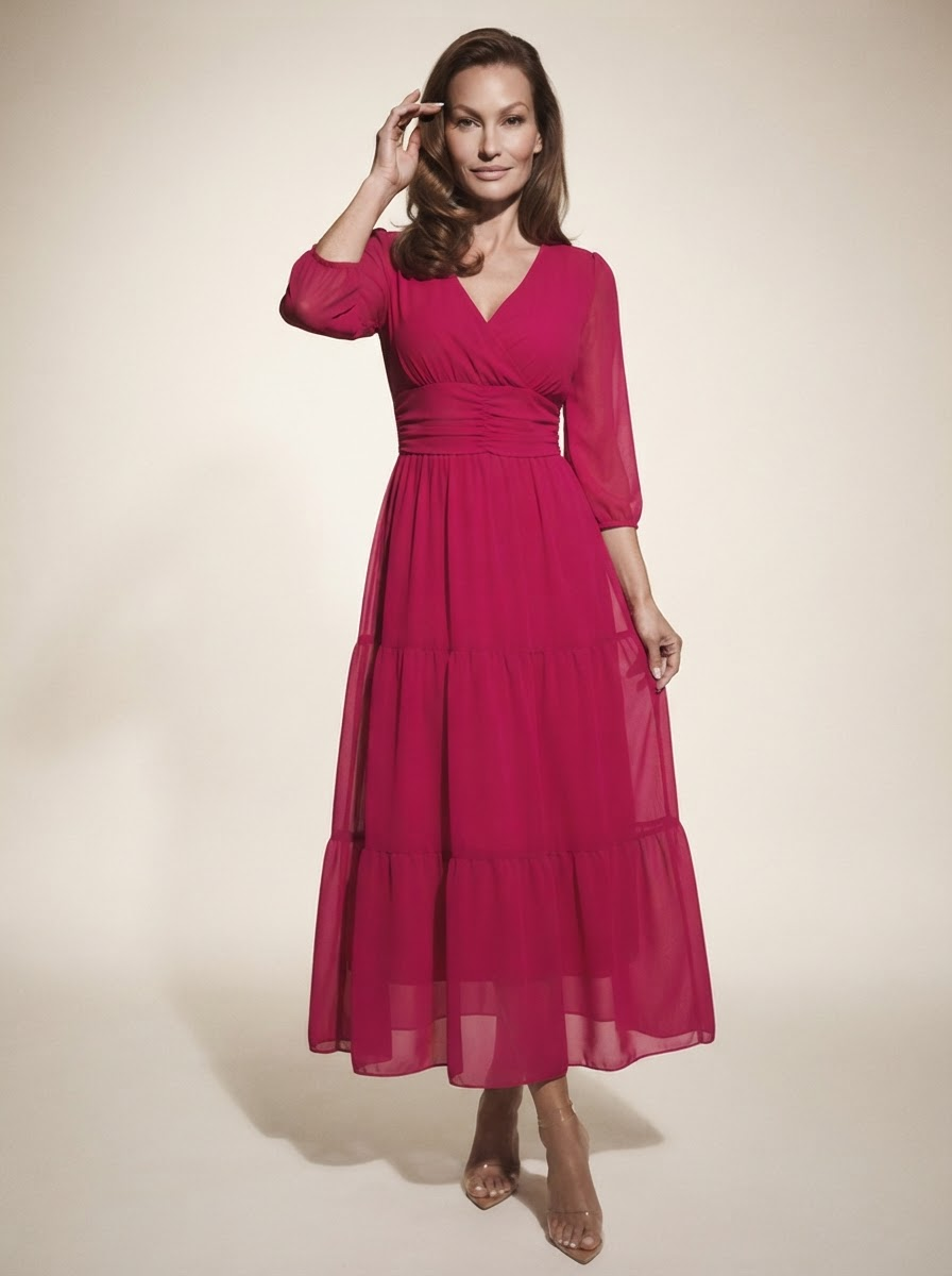 Model wearing pink sheer mesh overlay maxi dress
