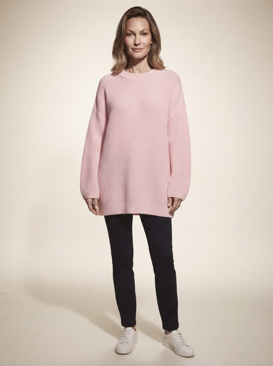 Model wearing pink loose fit long sleeve top