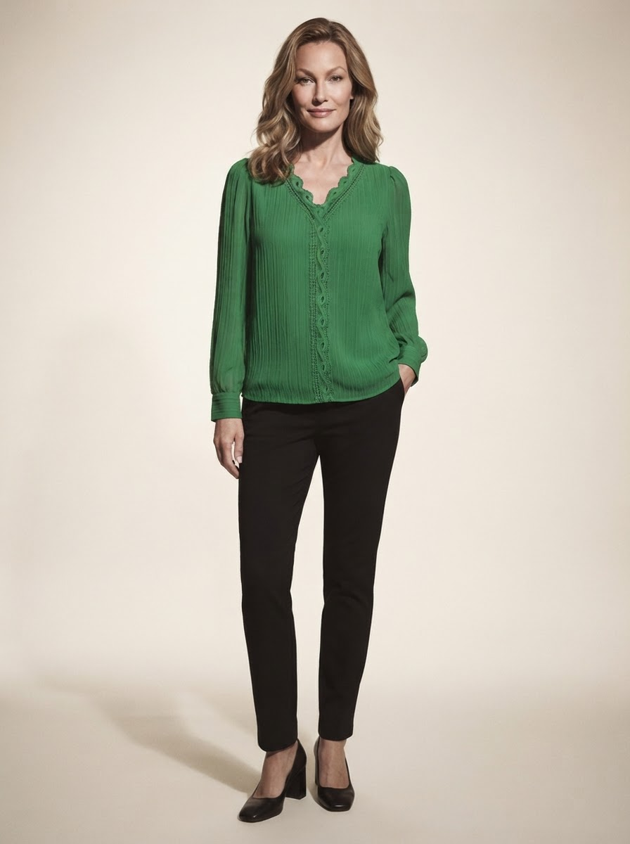 Model wearing green chiffon blouse with lace details
