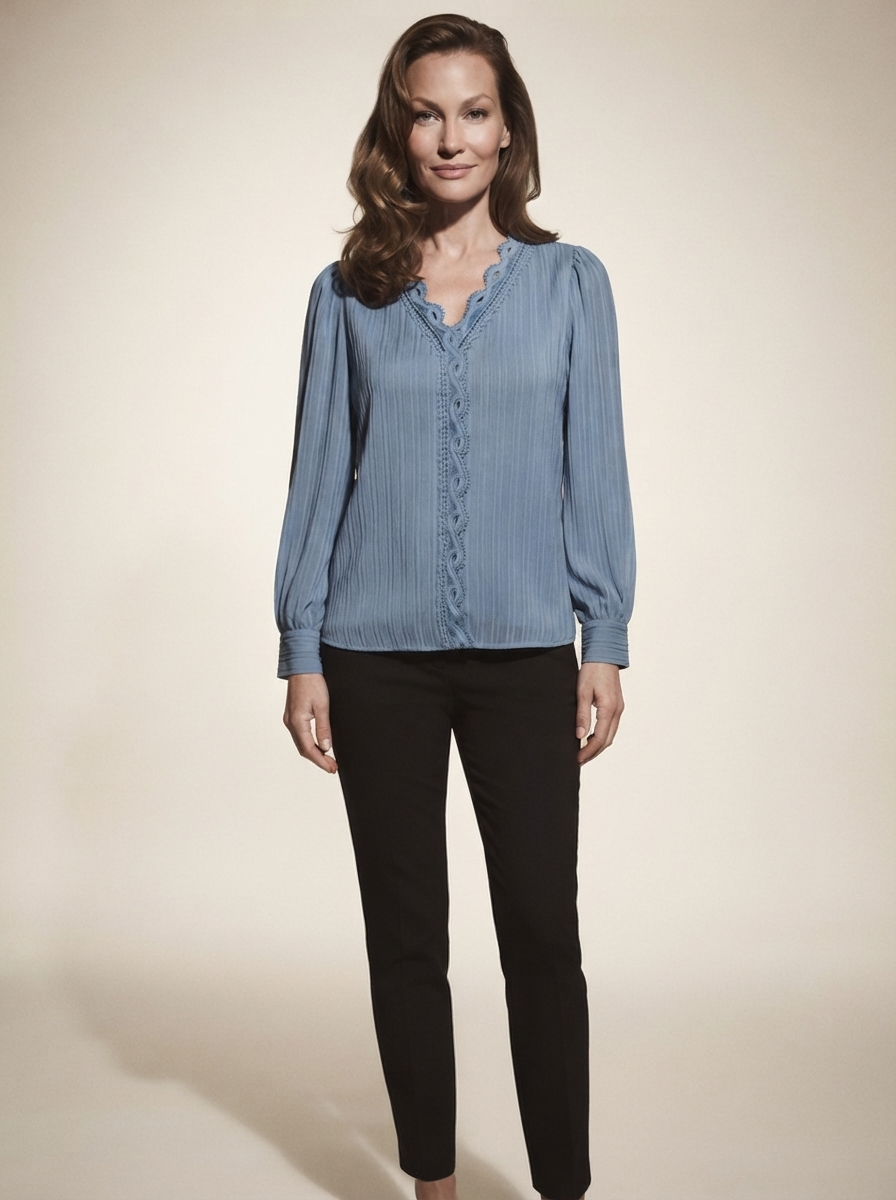 Model wearing blue chiffon blouse with lace details