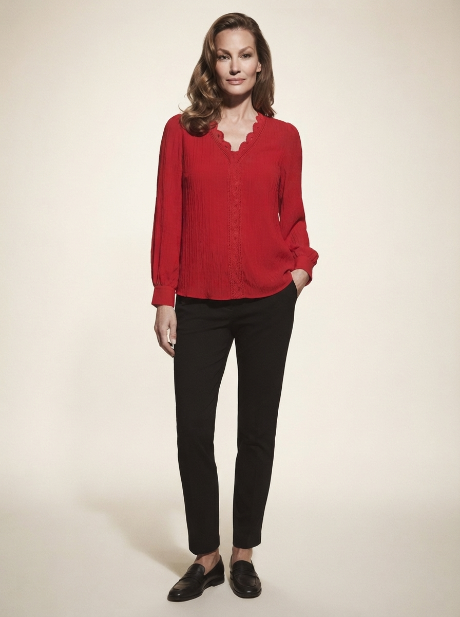 Model wearing red chiffon blouse with lace details