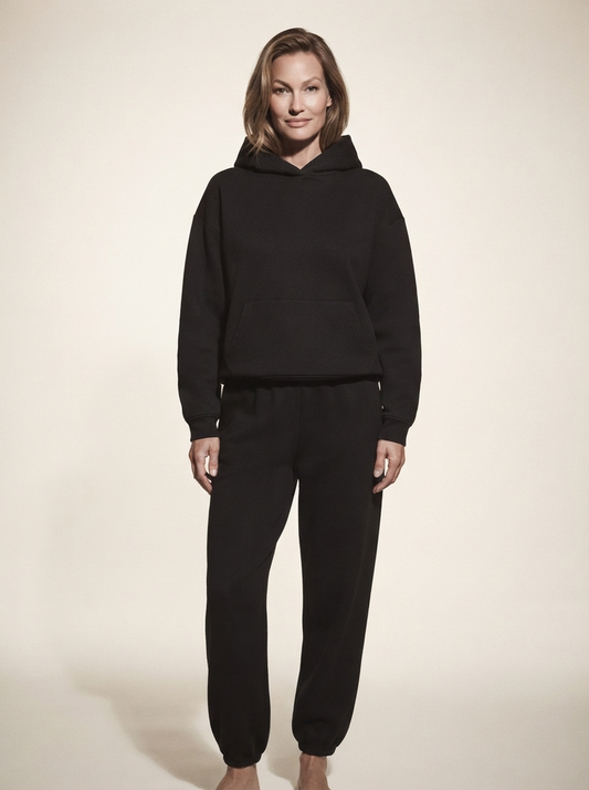 Model wearing black soft knit matching set