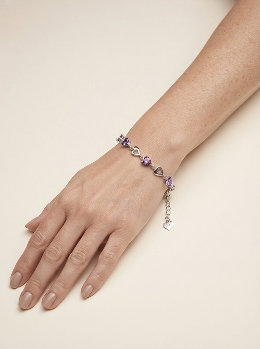 Close-up of model wearing purple crystal heart bracelet
