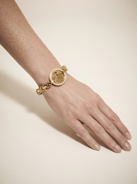 Close-up of model wearing gold-tone tree of life crystal bangle bracelet