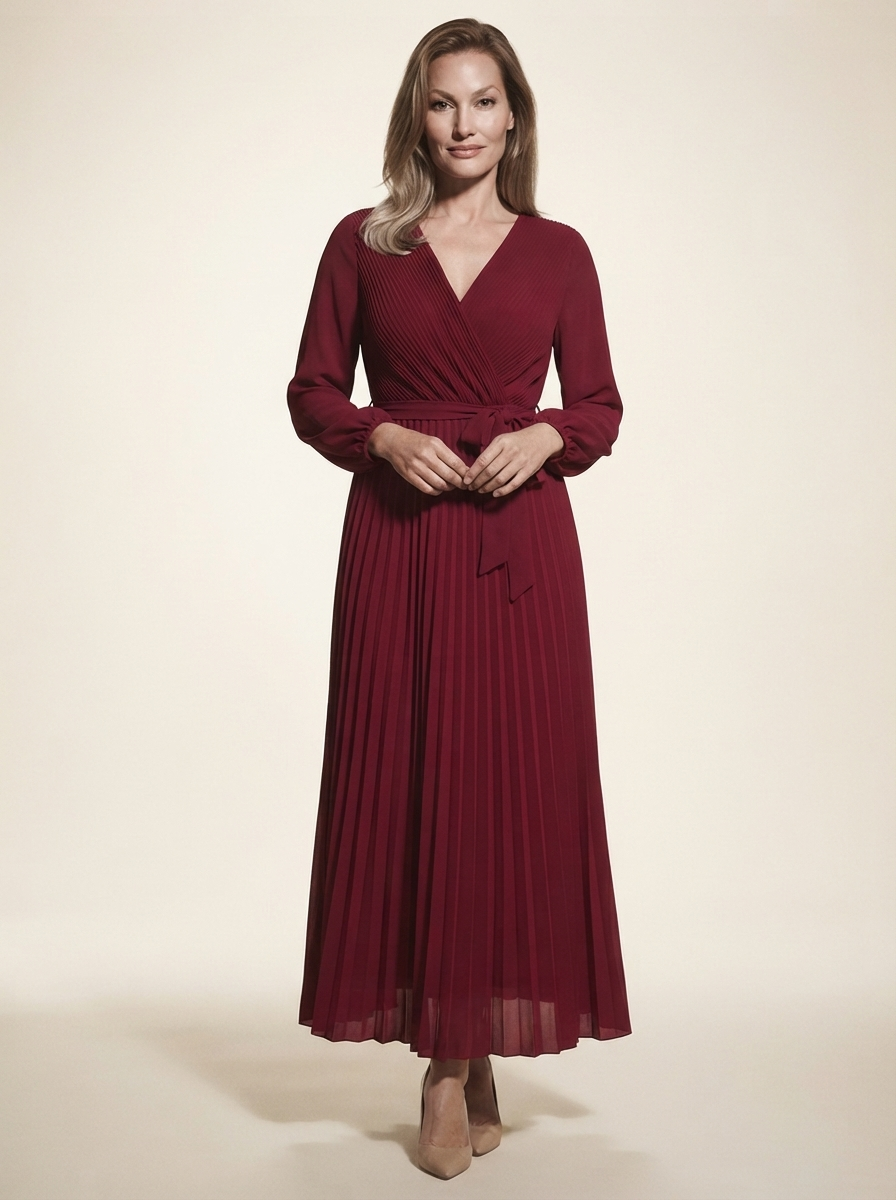 Model wearing red cross-pleated maxi dress