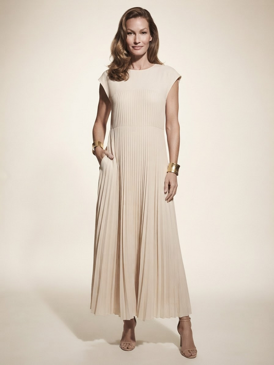 Model wearing beige high-waist pleated maxi dress