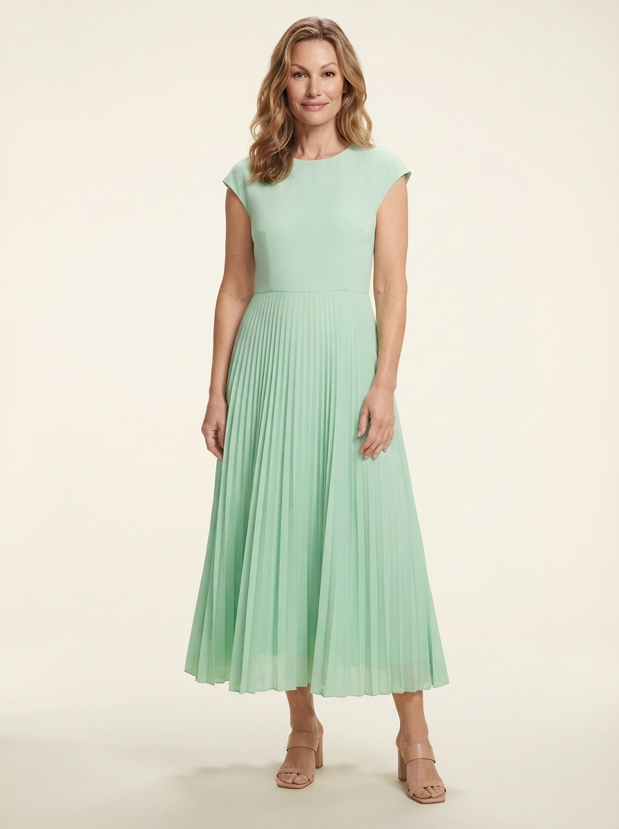 Model wearing green high-waist pleated maxi dress