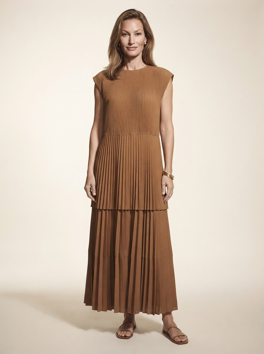 Model wearing brown high-waist pleated maxi dress