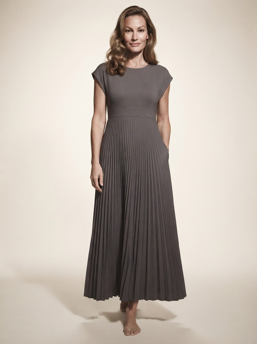 Model wearing gray high-waist pleated maxi dress