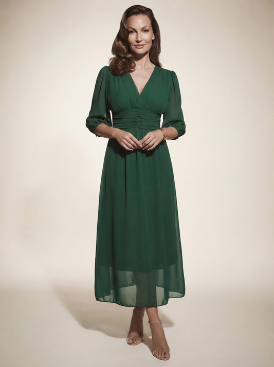 Model wearing green sheer mesh overlay maxi dress