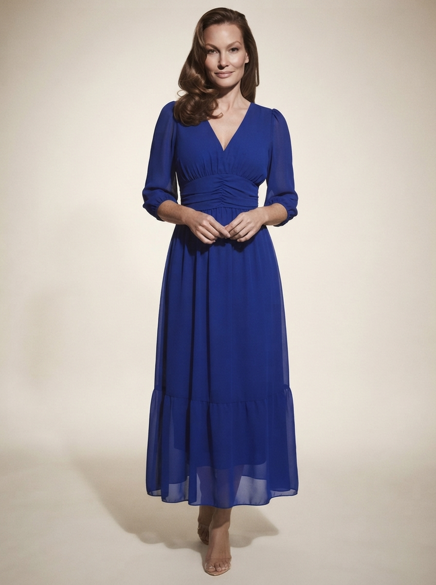 Model wearing blue sheer mesh overlay maxi dress