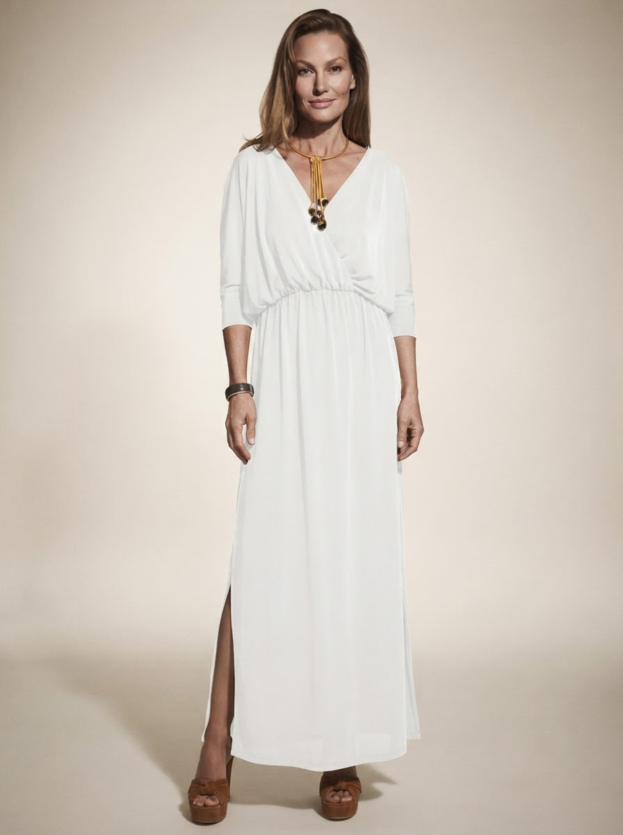 Model wearing white v-neck side-slit maxi dress