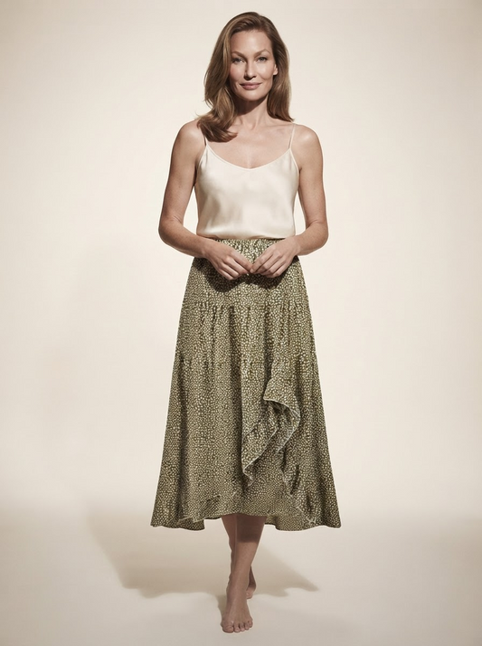 Model wearing green polka dot midi skirt